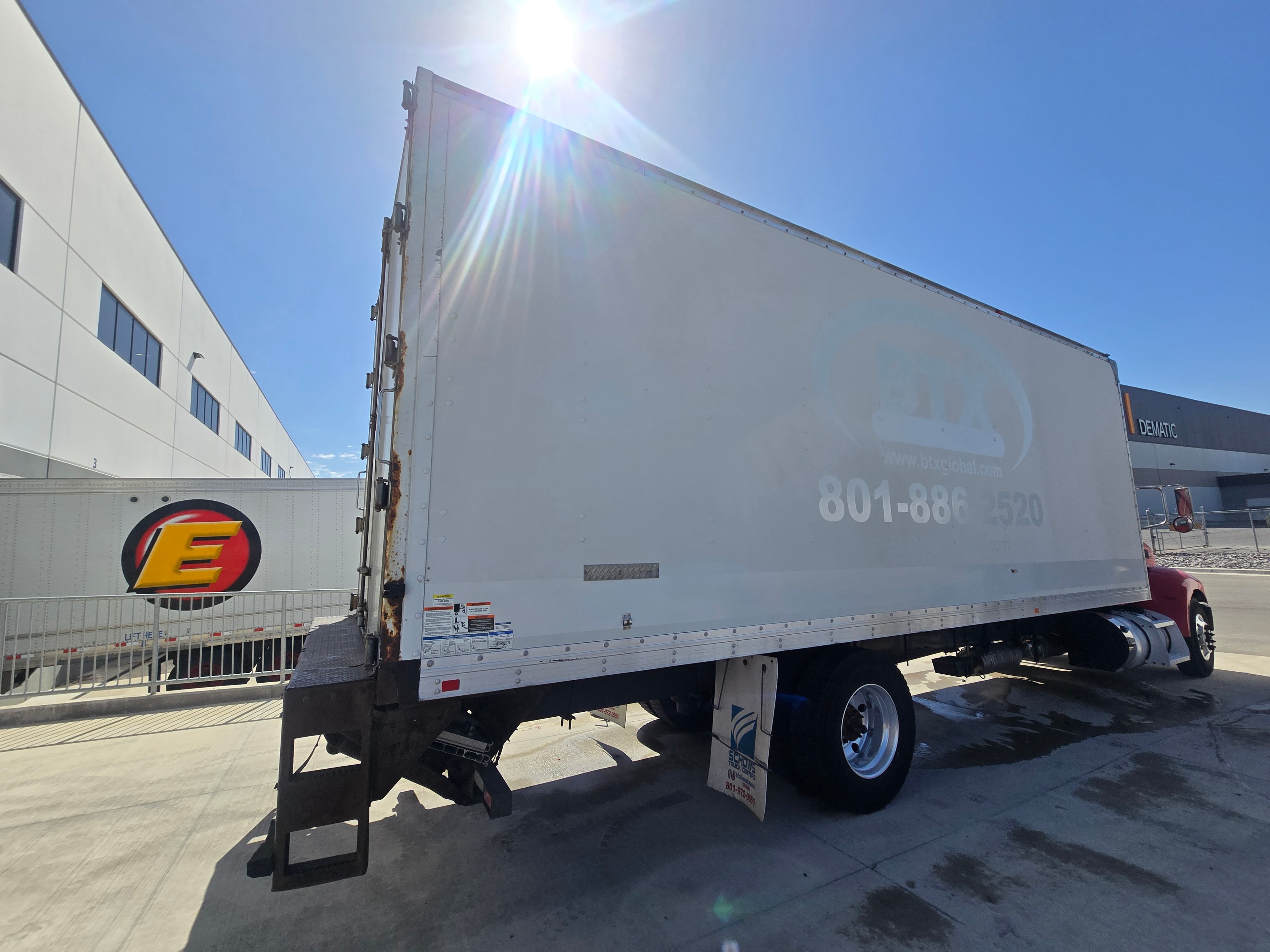 BTX Global Logistics box truck — rear angle after professional fleet de-identification