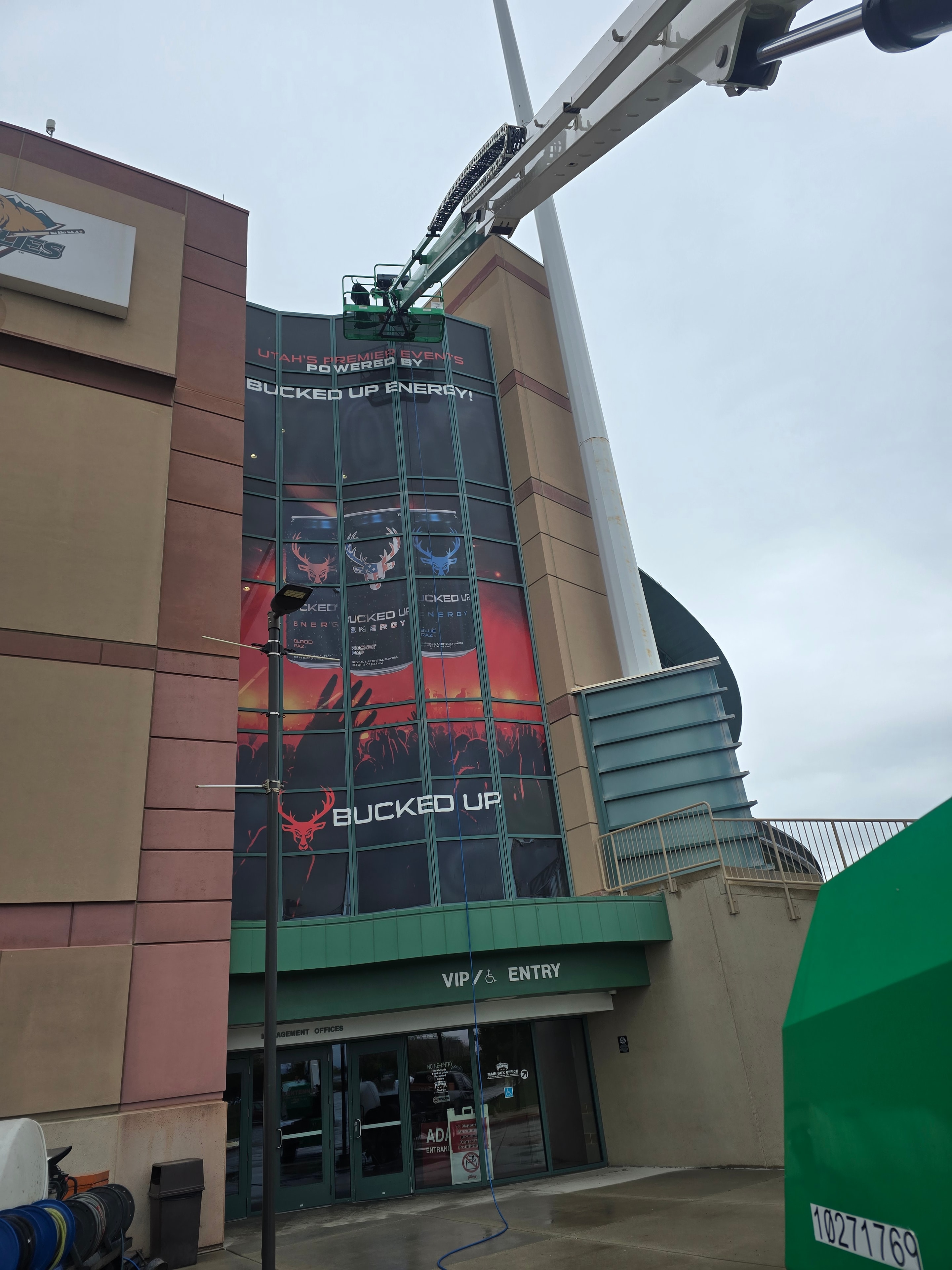Wide shot of Maverick Center exterior with Bucked Up wrap before cleaning — West Valley City, UT