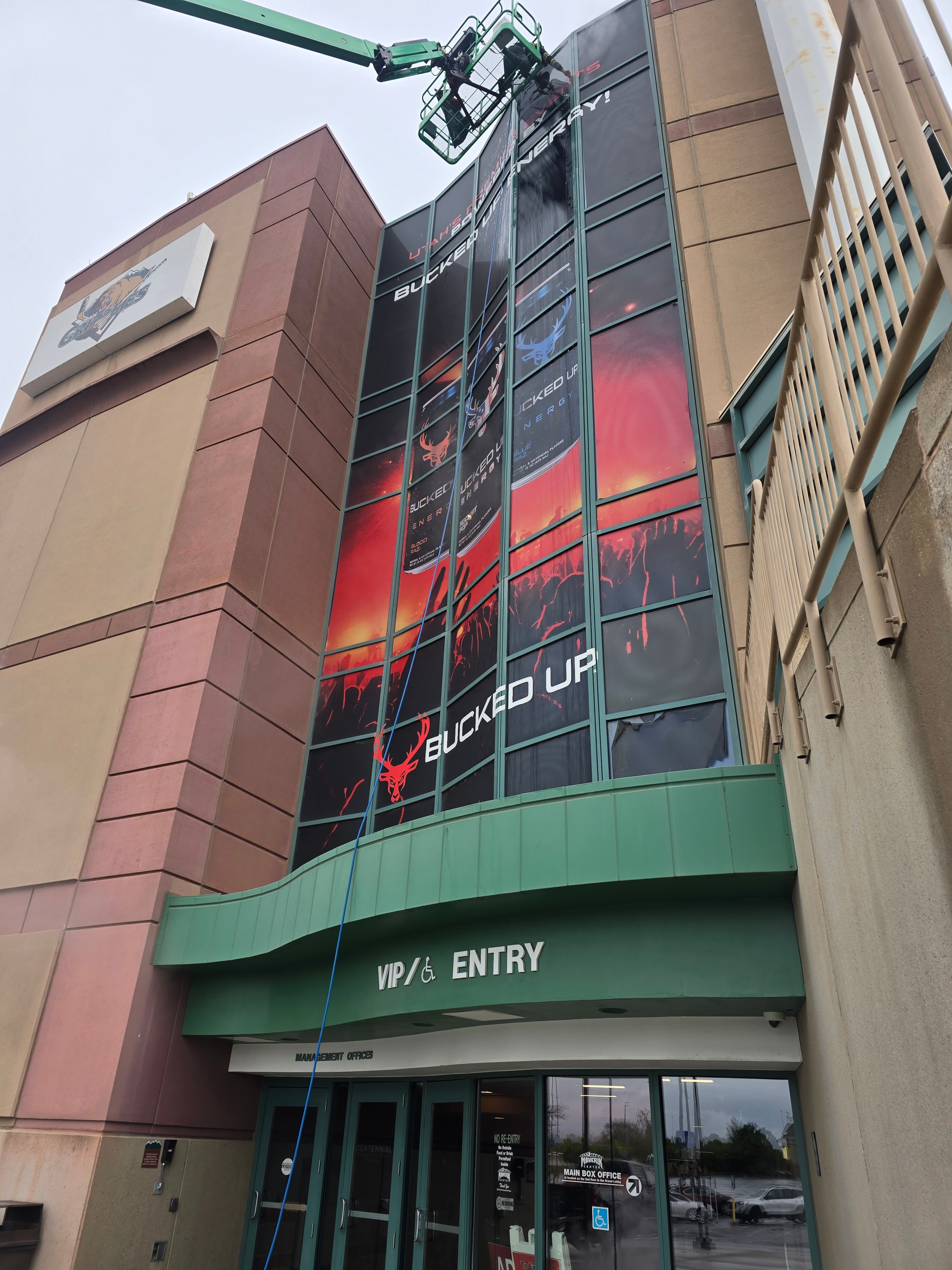 Maverick Center arena interior signage and entry area before cleaning — Bucked Up project