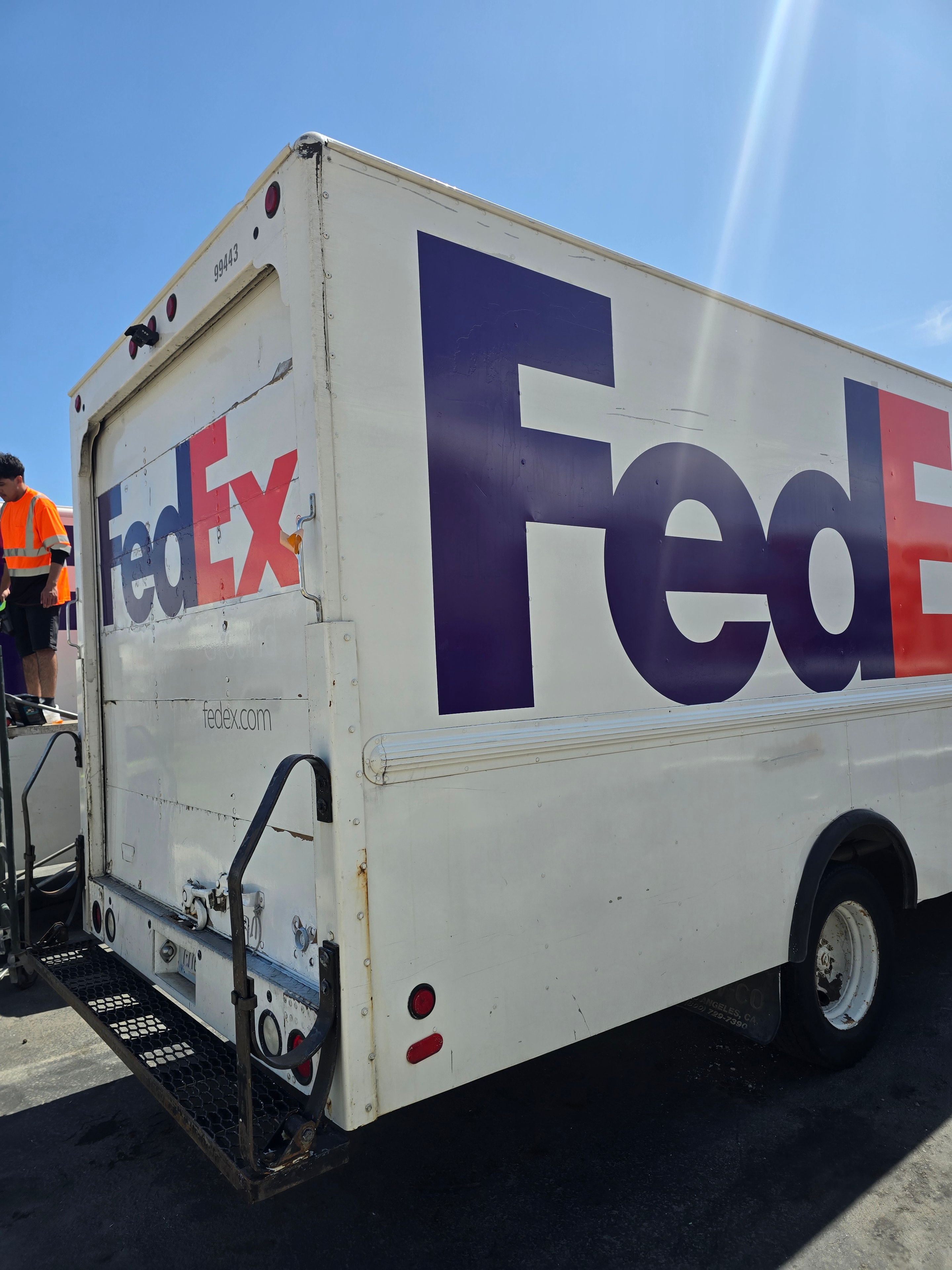 FedEx step van after de-identification and new decal installation — updated branding applied, Utah fleet rebranding project