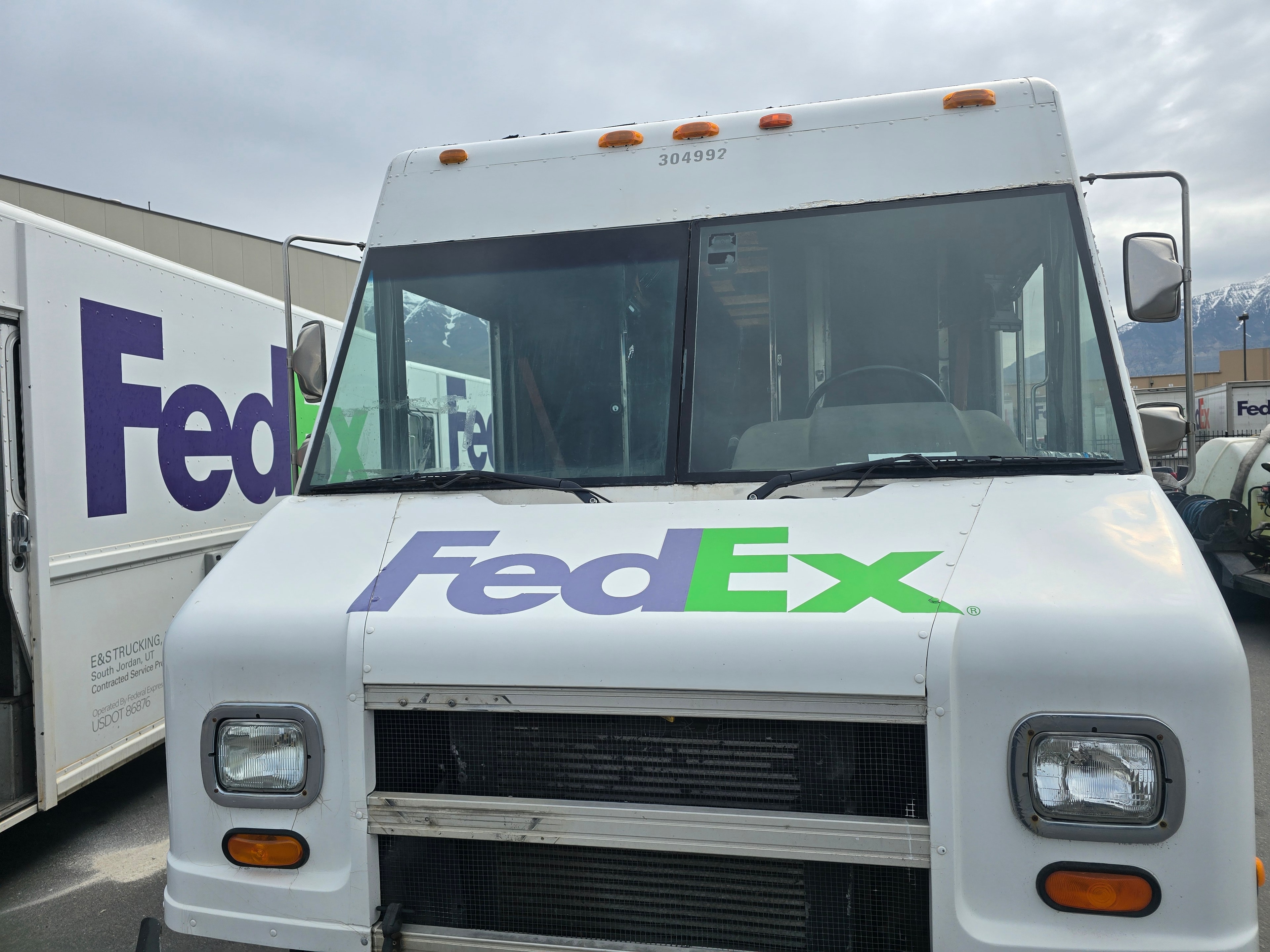 FedEx Ground step van #304992 — front face showing FedEx logo before fleet de-identification at Orem Utah facility