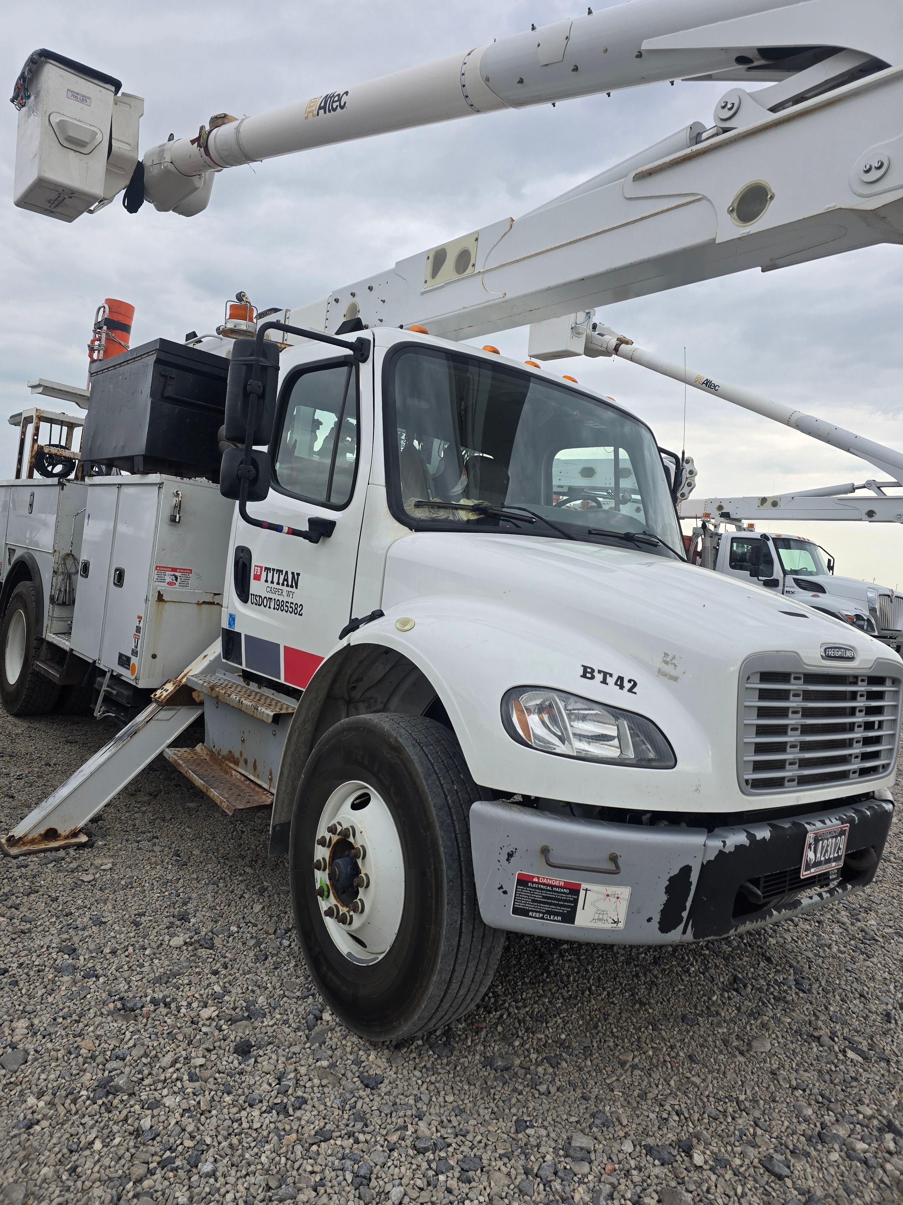 Titan Freightliner bucket truck BT42 before fleet washing — contaminants from daily utility operations