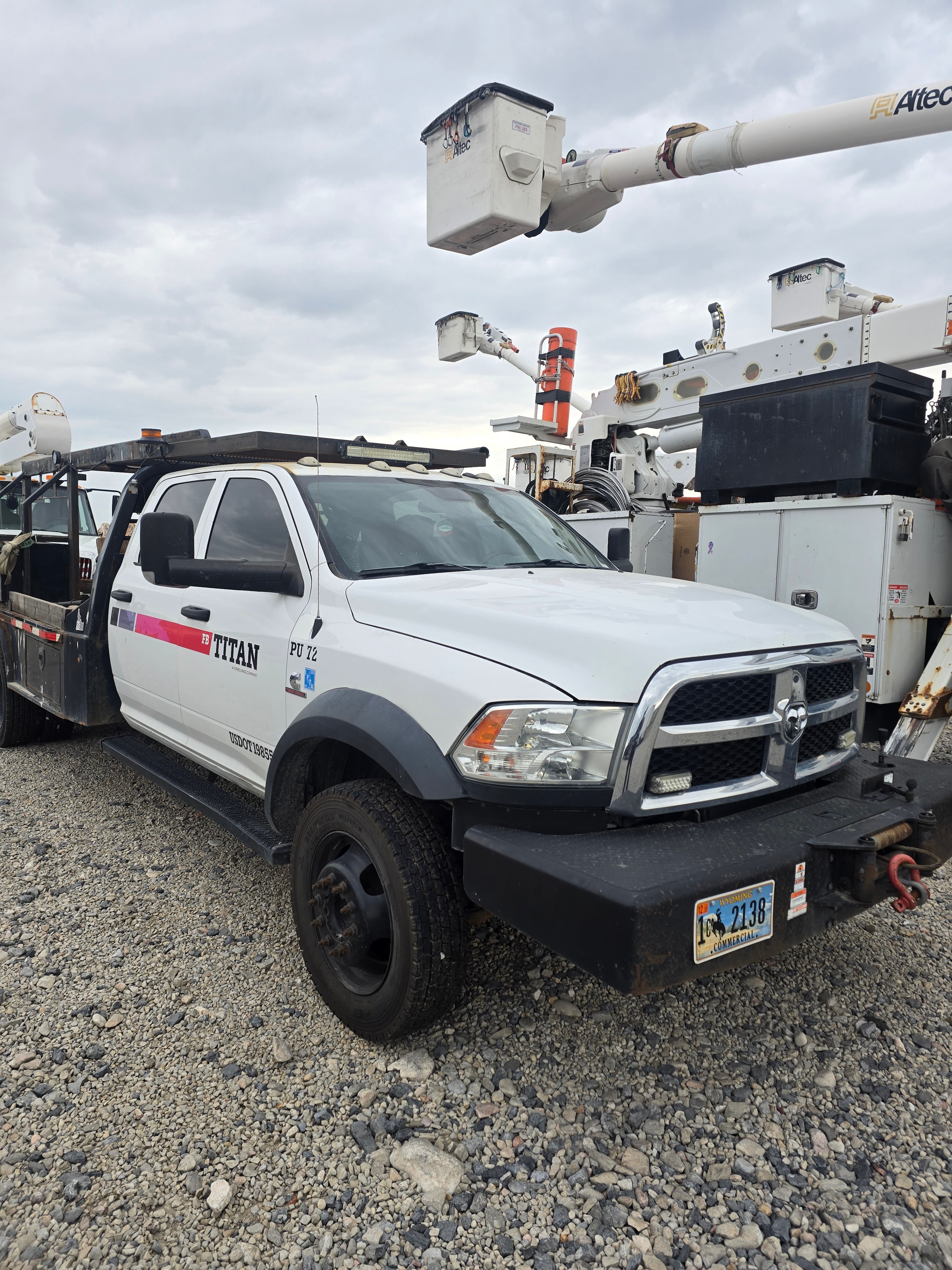 Titan Dodge Ram utility truck PU-72 before washing — dust and hydraulic residue buildup