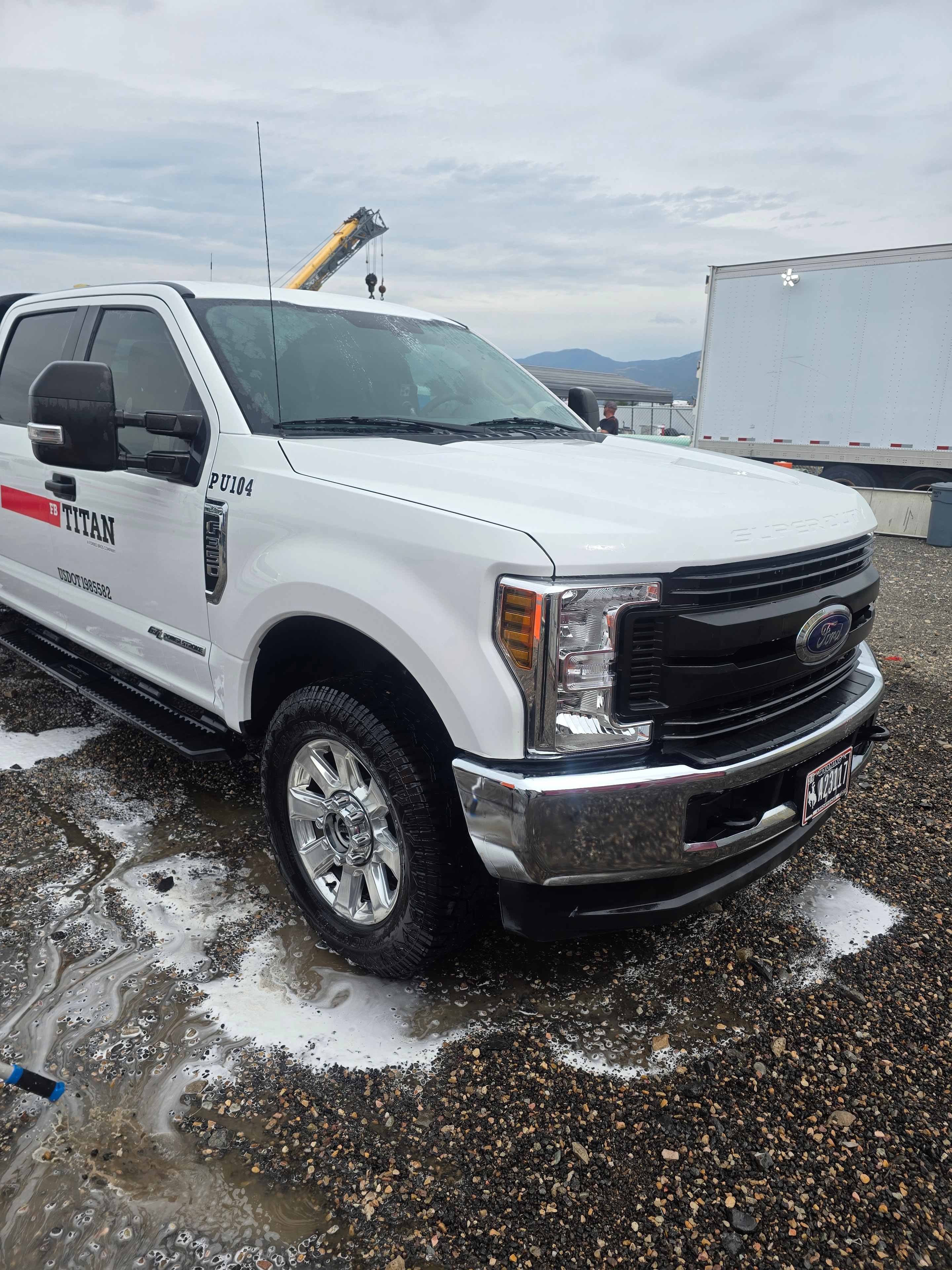 Foam application on Titan utility fleet vehicle during washing process